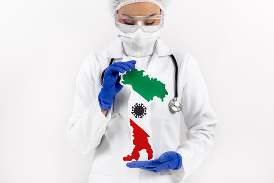 Doctor or nurse holding Italy map and flag. Coronavirus outbreak and pandemic concept. 2019-nCoV.