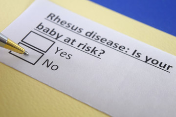 Obraz premium One person is answering question about rhesus disease.