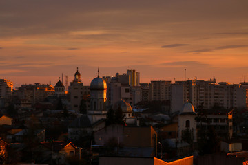 Fototapeta premium Old city buildings in the dusk , The city of Ploiesti , Romania in the golden light