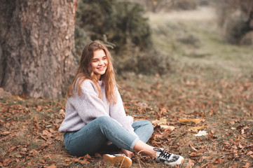 Smiling teen girl 15-16 year old wearing casual clothes posing outdoors. Happiness. 20s.