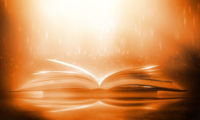 Abstract gold magic book on wooden background