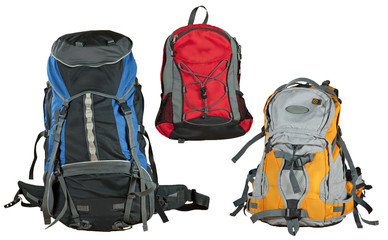Travel backpack isolated on a white background. Multicolored shopping bags close up. Several types...