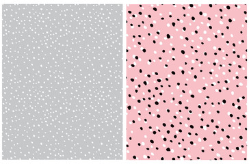 Cute Abstract Dots Vector Pattern. White and Black Irregular Brush Dots Isolated on a Light Pink Background. White and Gray Dotted Print.Lovely Pastel Color Delicate Design. Abstract Gray Snowy Sky.