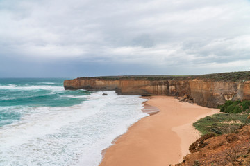 Rock formations with ocean sea waves on coastline. London Arch gorge on Great Ocean Road, Melbourne, Australia. Road trip to Australian coast line. Sand, sea, holiday, vacation. Twelve Apostles