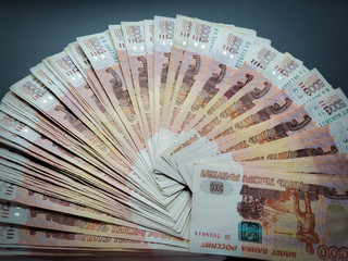 Cash on an isolated background. Russian banknotes spread out in a fan.
