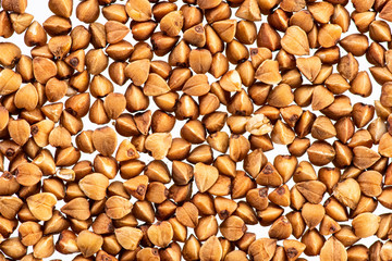 buckwheat brown seeds on a white background