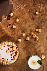 Yogurt on a wooden background. Summer food.