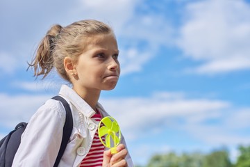Girl child blonde 9, 10 years old in profile, head closeup