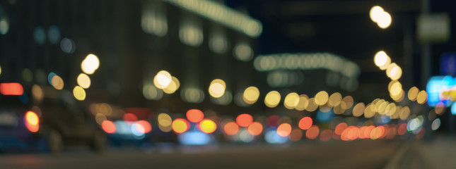 Defocused photography of Moscow cityscape in night time. Blurred motion of cars at motorway....