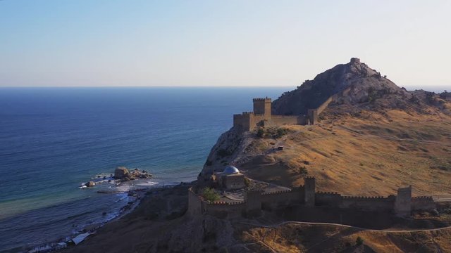 Sudak Genoese fortress on the mountain. Protective structure of the Middle Ages on the Black Sea coast in Crimea. Aerial view