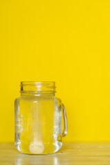 A tablet and a glass of water. Vitamin C
