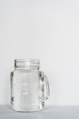 A tablet and a glass of water. Vitamin C