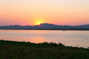 Boat on the river during sunset.