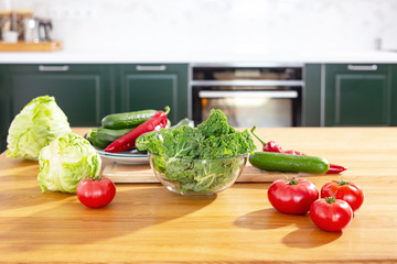 Fresh vegetables on the table. Kale cabbage, tomatoes, zucchini, cucumbers, paprika, white cabbage.
