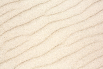 Fototapeta na wymiar Fine Sand texture with wavy pattern