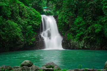 Fototapeta na wymiar BALI, INDONESIA 2020 - This waterfall in Bali is one of the many tourist destinations visited by tourists. January, 20th, 2020