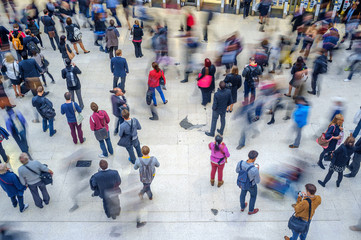crowd of people at train station - blurred motion