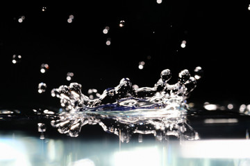 water splash like a crown on a dark blurred background