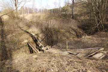 Broken wooden bridge across the river (Russia)