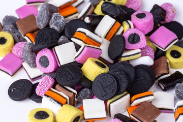 Obraz na płótnie Canvas Liquorice allsorts fondant and licorice sweets or candy studio isolated