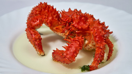 Kamchatka red king crab is boiled in boiling water in a pan.