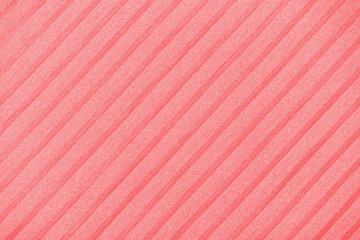 Fototapeta premium Plisse background toned in trendy color 2020 flame scarlet. geometric cloth lines. Fabric, textile close up.