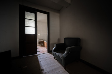 Dark room with a sofa