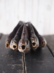 Air-dried,privately owned, freshwater river fish bream, on a dark wooden table.Close up.
