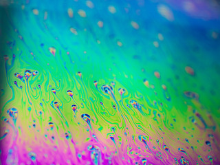 Fototapeta na wymiar a colorful soap bubble, close up