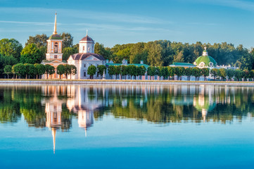 Kuskovsky Park, pond and Kuskovsky Palace at sunset. The estate of the Sheremetev family was built in 1769-1775. The Museum in Kuskovo. - obrazy, fototapety, plakaty
