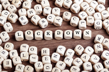 Lockdown word on cube letters, corona virus pandemic buzwword headline