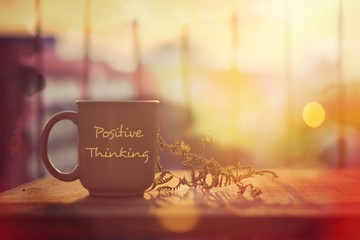 Having fun while enjoying a hot cup of coffee at home (Positive thinking concept) 