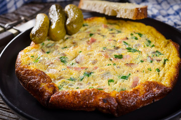 Omelette with ham and parsley.