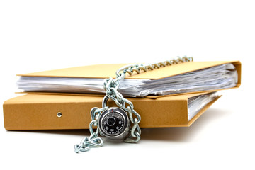 Cardboard document folders locked with chain and padlock.