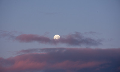 bright moon over cloudy sky