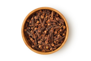 Cloves in wooden bowl on white background