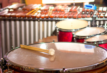 Fototapeta na wymiar Drum sticks on the drum. Big drum in the concert hall.