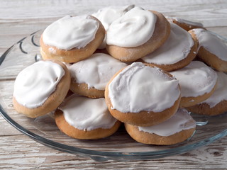 Homemade gingerbread cookies with fondant on a rustic table