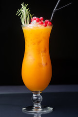 .refreshing alcoholic cocktail with red currants and orange