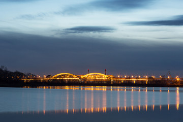 Beautiful bright sunset in the city of Nizhny Novgorod over the Volga River with a view of the Typeset bridge and the Meshchera microdistrict