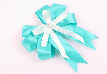 Bow made from blue and white ribbon isolated on white