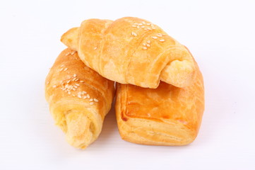 Fresh and tasty croissant on white background