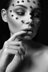 girl in steel mask. beautiful girl with spikes on her Face