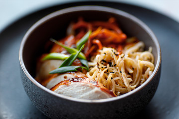 asian style chicken noodles onion and sesame