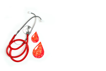 Stethoscope and blood drop symbol on white background with copy space.