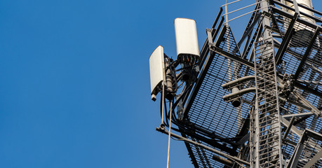 A telecommunications tower with mobile / cellular transmitters and receivers