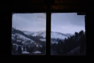 View of mountain landscape from window inside Brans castle in Bran Romania
