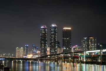 Obraz na płótnie Canvas The night view of skyscraper and city and sea in Haeundae district, Busan, South Korea