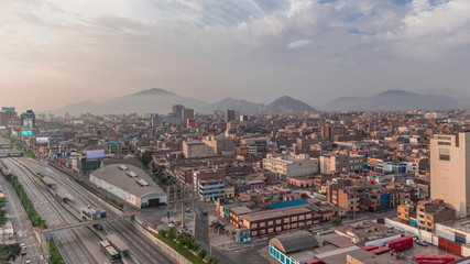 Obraz premium Aerial view of Via Expresa highway and metropolitan bus with traffic timelapse. Lima, Peru