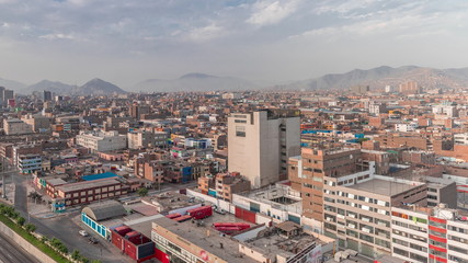 Obraz premium Aerial view of Via Expresa highway and metropolitan bus with traffic timelapse. Lima, Peru